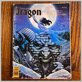 The cover to Dragon Magazine #114. A nude woman supplicating dark gods atop a huge ruined idol.